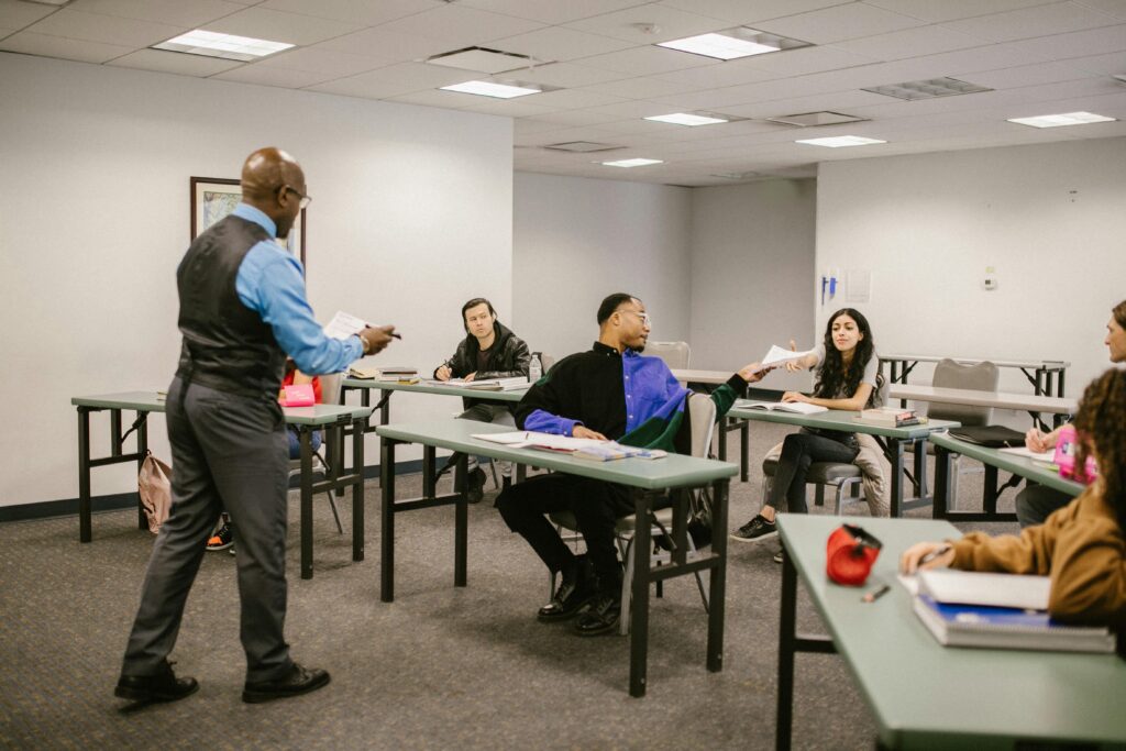 University classroom with students receiving instructions from a professor.